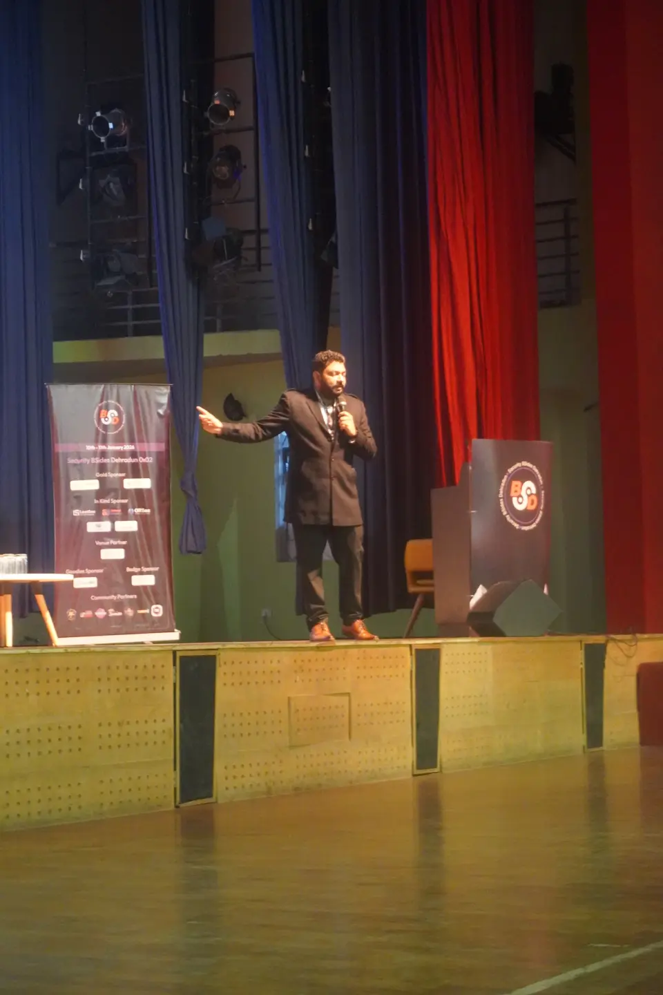 A speaker presenting on stage